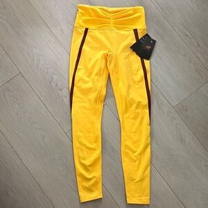 New Balance X Bandier Collaboration Yellow Leggings with Brown Stripe